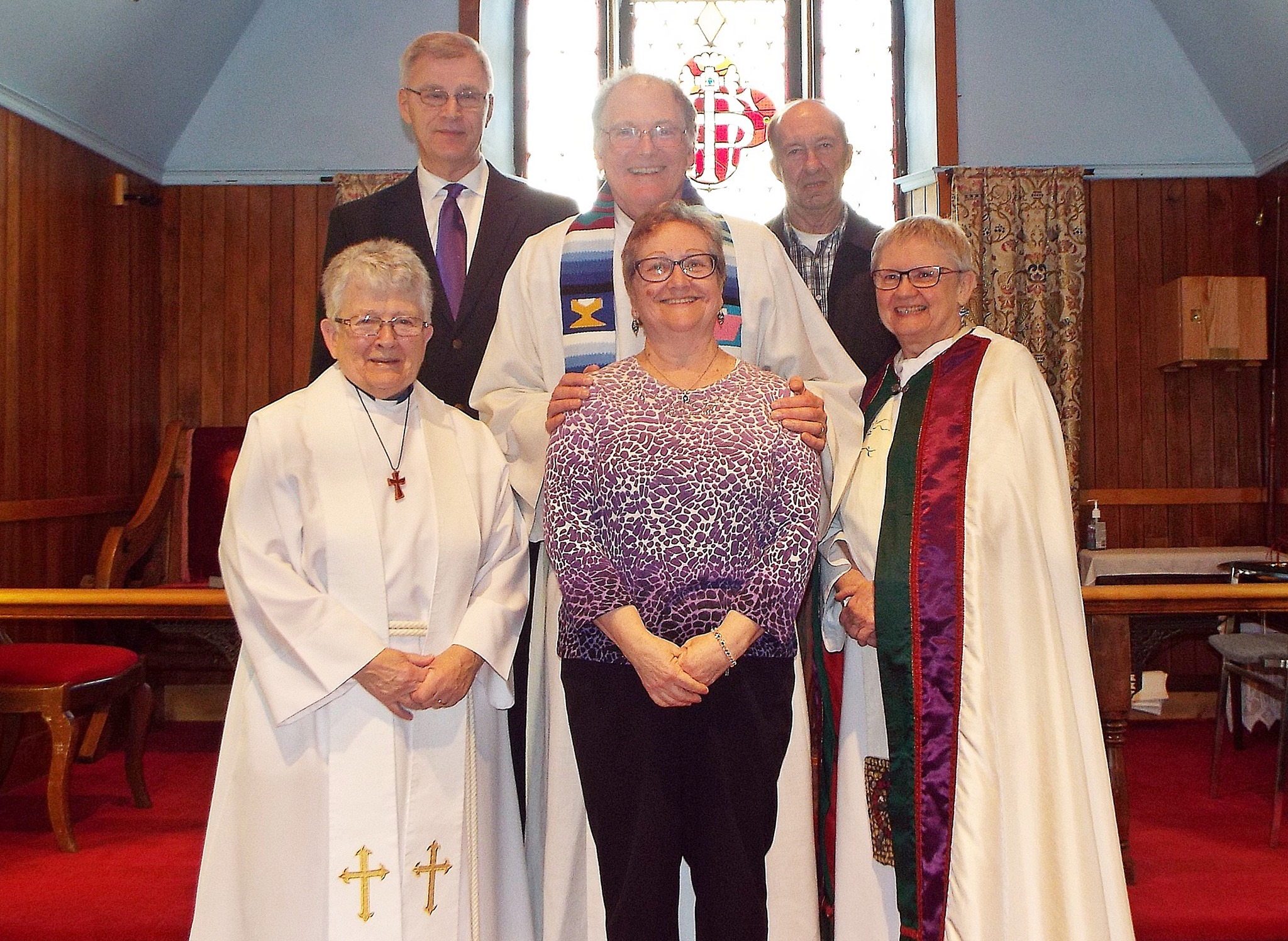 Members of St John's Anglican Church gathered together inside the church